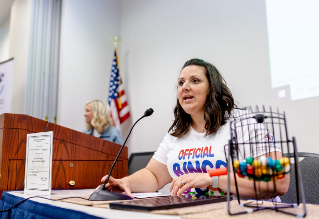 Bingo caller speaking into microphone